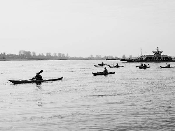 Week 10 - Sunday Outing. A group of kayakers in early March on their way downstream. In the background the Rhine ferry Langst-Kierst.