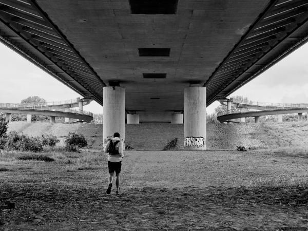 Week 22 - Under the Rhine Bridge. A runner under the Flughafenbrücke (airport bridge) on the way from the Rhine bank to the Rhine dike.