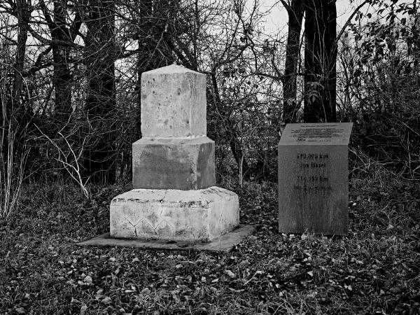 Week 51 - Myriameter stone LIX. In 1867, the Rhine riparian states decided to set "Myriameter stones" as measuring points every 10,000 m ( = 1 "Myriameter") on both sides of the Rhine as part of a Rhine survey. Near Meerbusch-Nierst one of these stones has been preserved until today. Towards the Rhine side, the stone is inscribed with the number "LIX" (59) in Roman numerals, which means that it is the 59th Myriameter stone from the Rhine bridge in Basel. Towards the land side, the inscription, which is unfortunately hardly legible today, reads "590 kilometers from Basel, 234 kilometers to Rotterdam". The Myriameter stone, which is now over 150 years old, is now a historical monument.